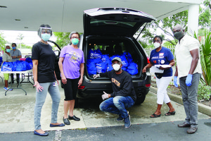 Hundreds receive food at drive-thru distributions held by Primary Medical Care Center, City of Lauderdale Lakes