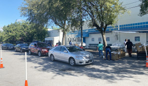 Hundreds receive food at drive-thru distributions held by CHS and Commissioner Monestime